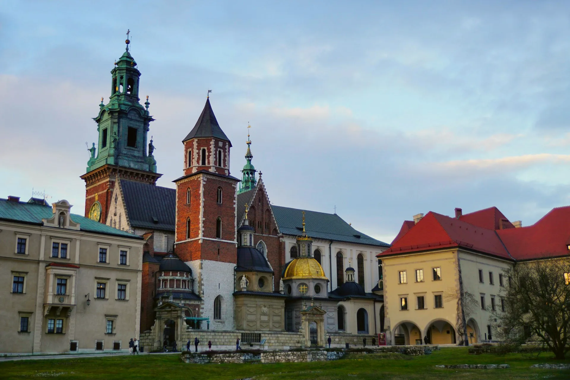 Wawel Royal Castle in Kraków, with its clock tower rising above the surrounding buildings.
